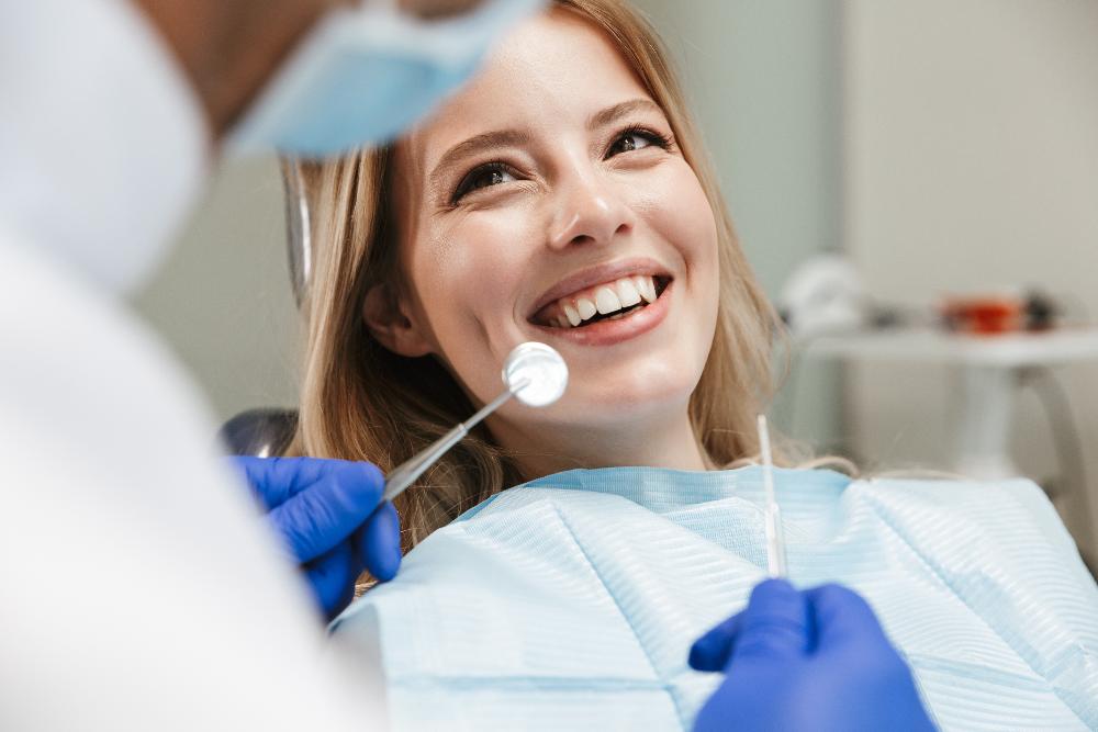 woman smiling in dentist exam chair | dentist cookeville tn