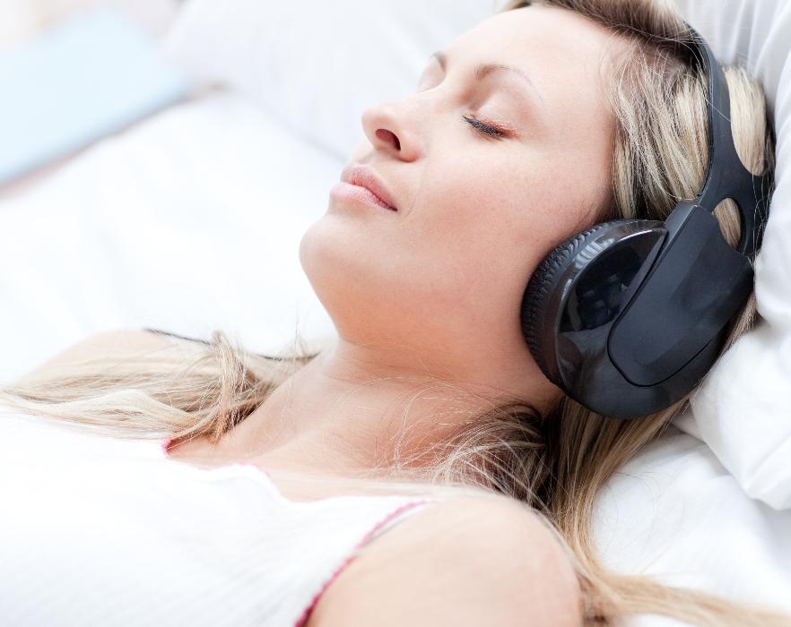 woman with headphones | sedation dentistry cookeville tn